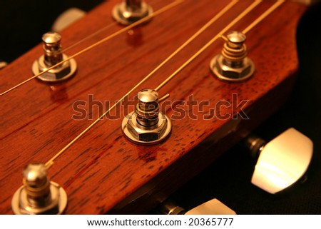 tuning pegs guitar. neck and tuning peg.