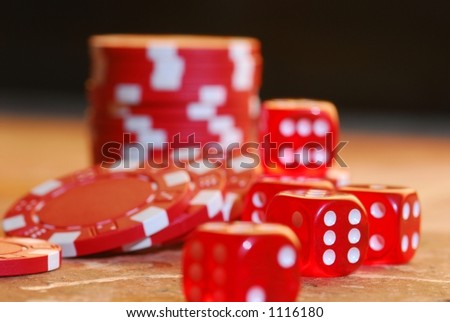 red dice with red poker chips