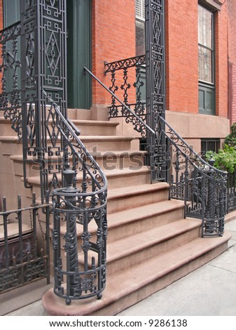 Entrance to Greenwich Village, NYC townhouse with ornate wrought iron railings