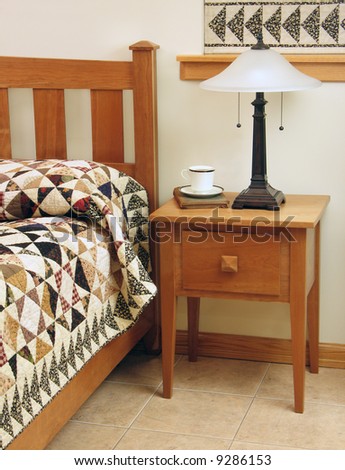 Bedroom with Mission-style bedroom furniture and handmade patchwork quilt