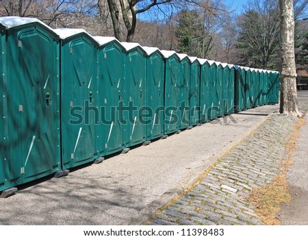 Line of portable toilets in Central Park, Manhattan, NYC