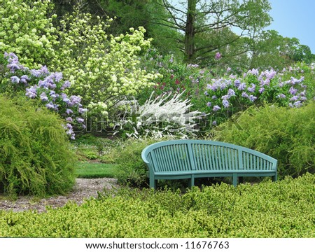Empty garden bench in shrub garden at Winterthur Estate in Delaware, USA