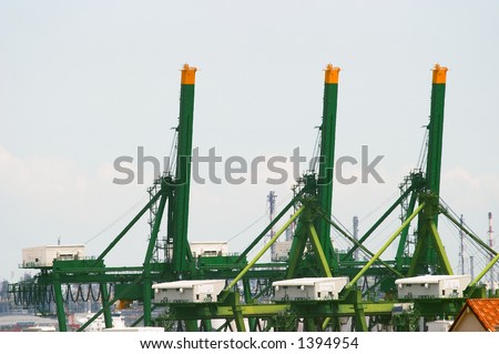 Huge gantry at busy port, image can be used to show a busy port, prosperity of a harbour.