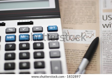 Stock chart analysis, calculator, with pen, horizontal orientation. charts, analysis, ups and downs, shallow depth of field
