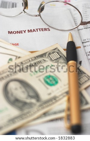 Money Market analysis, calculator, horizontal orientation. closeup, cash, headlines, shallow depth of field