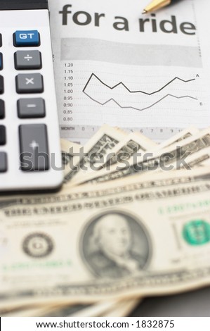 Stock chart analysis, calculator, with pen, vertical orientation. charts, analysis, ups and downs, closeup, cash, shallow depth of field