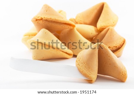 Many Chinese fortune cookies stacked up, one stand out, on white background, side view, with a white piece of paper for entering text/fortune