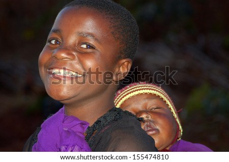 POMERINI VILLAGE, TANZANIA - CIRCA AUGUST 2013:The Franciscan Mission for Humanitarian Aid - The look on the faces of the children of Africa, many of them sick with AIDS, a look for the future