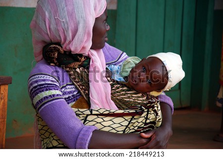 August 2014 - Village of Pomerini - Tanzania - Africa - An African woman with her child. received into the Franciscan Mission for Humanitarian Aid for Aids