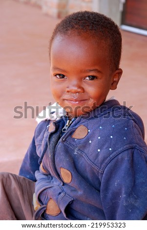 August 2014-Tanzania-Africa - An unidentified African child assisted by the Franciscan Mission of the village of Pomerini in the area affected by the virus AIDS.
