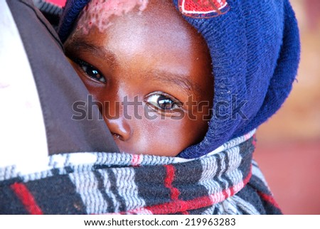August 2014-Tanzania-Africa - An African unidentified child assisted by the Franciscan Mission of the village of Pomerini in the area affected by the virus AIDS.