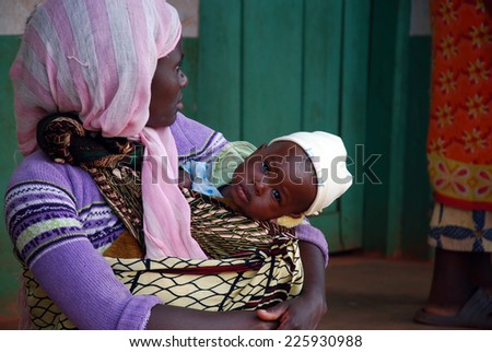 August 2014-Village of Pomerini-Tanzania-Africa-A mother with her child received into the Franciscan Mission of the village of Pomerini, an area hard hit by the AIDS virus