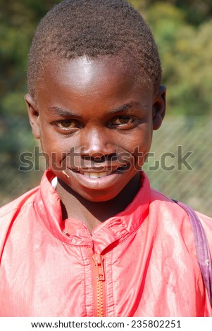 August 20, 2014-Village Pomerini-Tanzania-Africa-African child sick of the virus AIDS, helped by the Friars of the Franciscan Mission to give him the necessary medicines, a smile and a possible future