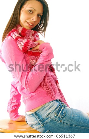 stock photo A pretty brunette sexy posing in a pink tracksuit