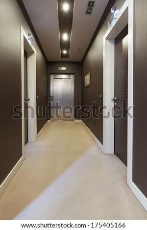 Interior of a corridor with a view to elevator door