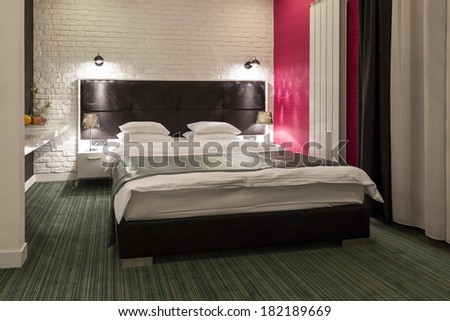 Interior of a hotel bedroom in the evening