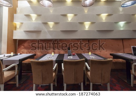 Interior of a hotel restaurant ready for dinner service