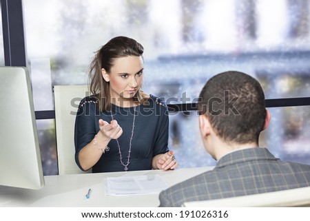Young executive unsatisfied with the performance of the employee, demanding explanation - concept