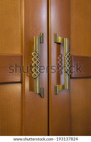 Wooden cabinet doors with metal handles
