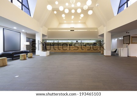 Spacious hotel lobby with reception desk