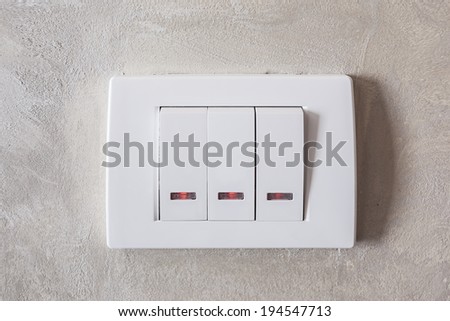 Light switches with indicator on concrete wall