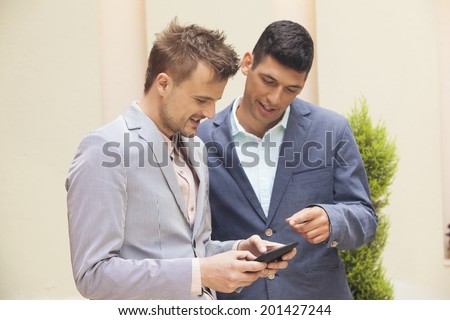 Two businessmen sharing information