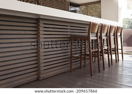 Cafe bar interior - wooden bar and bar chairs