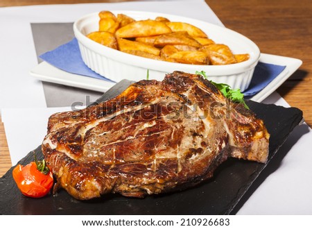 Rib eye steak with spiced potatoes