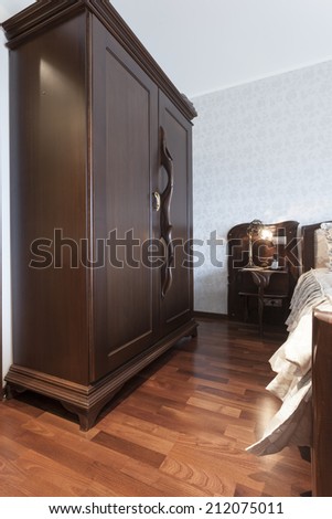 Massive wooden closet in bedroom