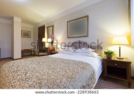 Cozy bedroom interior in the evening