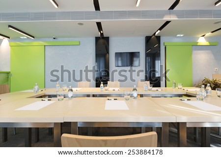 Tables prepared for conference in modern conference hall