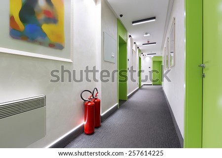 Fire extinguishers in hotel corridor