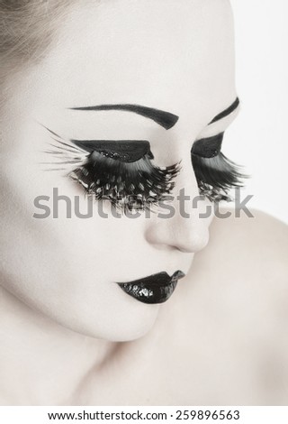 Gorgeous young model with perfect art make up and long false eyelashes