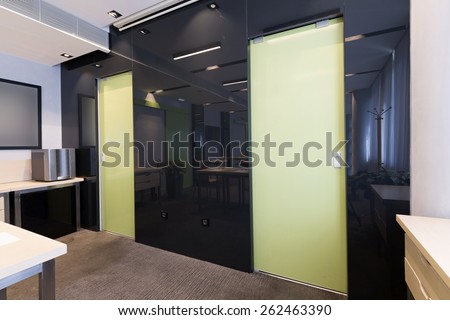 Classroom in reflection in black glass wall