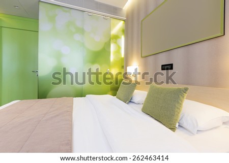 Green hotel bedroom interior