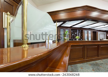 Hotel lobby with wooden reception desk