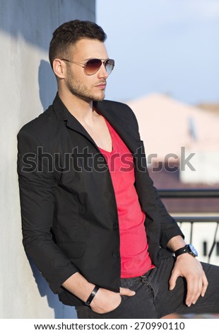 Handsome young male model posing outdoor