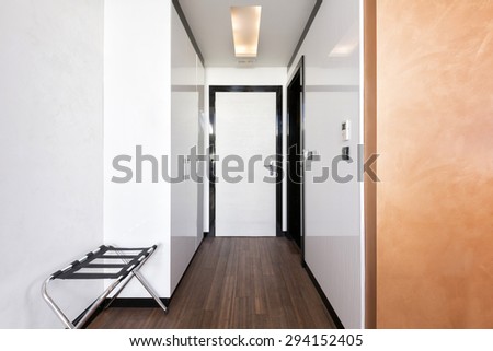 Corridor with closet in hotel room