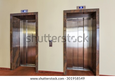 Two elevators in hotel lobby