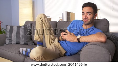 Mexican guy chilling on couch