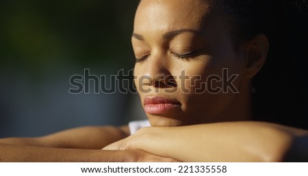 Black woman crying outdoors