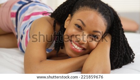 Happy black woman smiling at camera