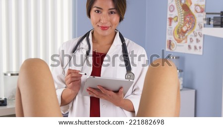 Japanese gynecologist examine patient in hospital exam room
