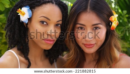 Close up of Beautiful African American and Asian women on vacation together