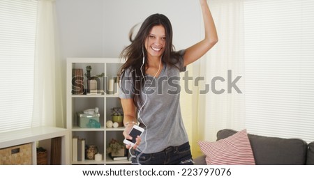 Pretty woman dancing in her living room