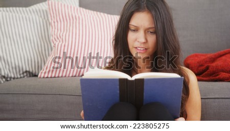 Young woman reading a good book