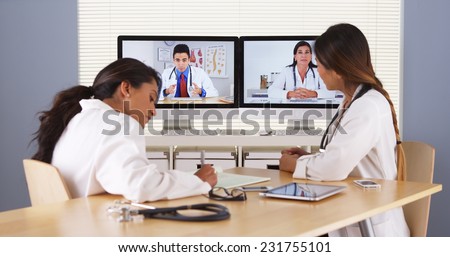 Professional team of multi-ethnic medical doctors having a video conference