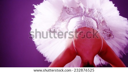 Woman ballet dancer standing on tiptoes bowing