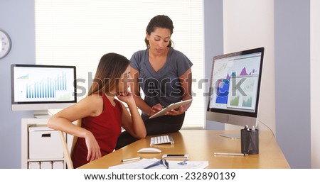 Professional team of mixed race businesswomen working in office