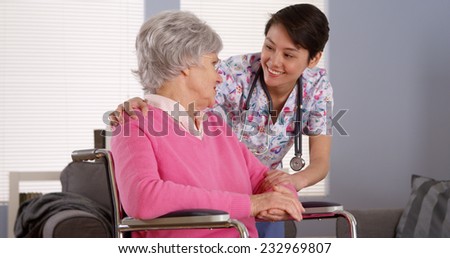 Asian nurse talking with Senior patient